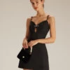 The Black V Neck Cutout Sleeveless Mini Dress