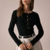 The Black Boat Neck Bowknot Front Knit Top