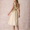 The Light Yellow Pleated Cross Back Midi Dress