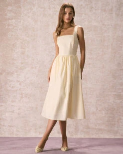 The Light Yellow Pleated Cross Back Midi Dress -Outlet Dress Mix Up Store the square neck solid midi dress dresses 75iow3